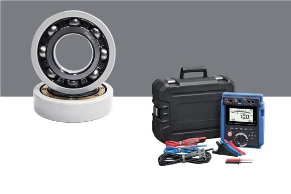 Engineering lab setup testing the bearing dielectric strength of an insulated inner ring using high-voltage electrodes.