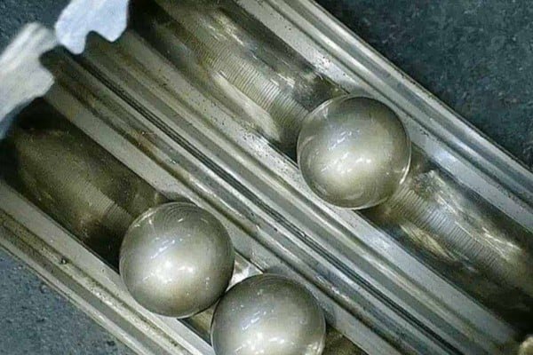 Close-up view of a bearing raceway displaying the distinct parallel "washboard" grooves caused by electrical fluting.