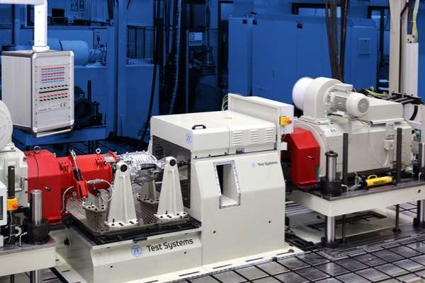 An electric vehicle motor on a dynamometer test bench, a critical application requiring hybrid bearings to withstand high-frequency simulation drives.