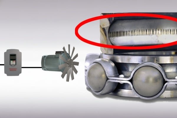 A VFD drive connected to an industrial motor, highlighting the microscopic electrical discharge machining (EDM) fluting damage on the bearing raceway caused by shaft voltage.