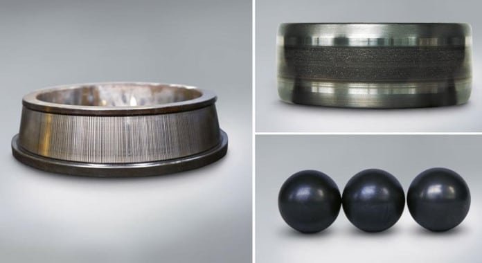 Close-up of a steel bearing raceway showing the distinct "washboard" fluting pattern caused by VFD electrical discharge.